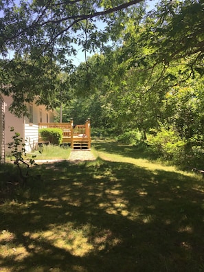 Escape to a serene oasis surrounded by lush greenery and a tranquil atmosphere.