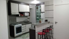 Fridge, microwave, oven, cookware/dishes/utensils