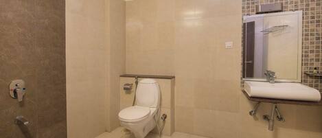 A bathroom with a shower, toilet, and sink.