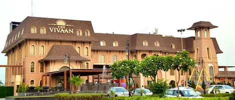 A large, historic building with a prominent sign reading "The VIVAAN."