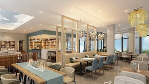A modern restaurant with a bar area, seating arrangements, and a view of the outdoors.