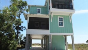 A two-story building with a balcony on the upper floor.
