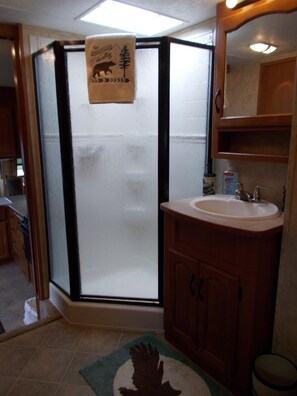 Shower, hair dryer, towels, soap
