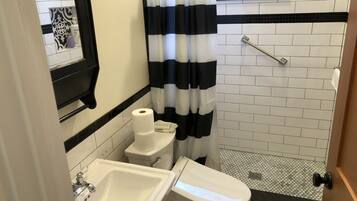 Combined shower/tub, hair dryer, towels, soap