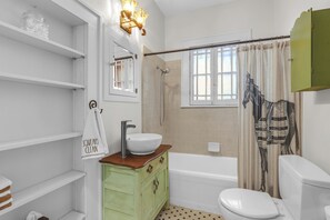 Combined shower/tub, hair dryer, towels, soap