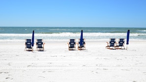 On the beach, sun-loungers
