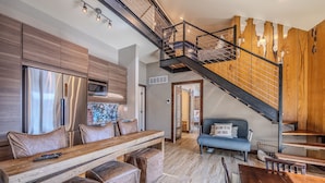 A modern kitchen with a stainless steel refrigerator, wooden cabinets, and a built-in oven. - Upscale Lakefront Luxury at Lake of the Ozarks - Private Dock, Quiet Cove (Lake Ozark)