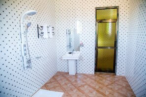 Shower, free toiletries, slippers, towels