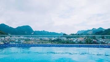 Indoor pool, pool umbrellas, pool loungers