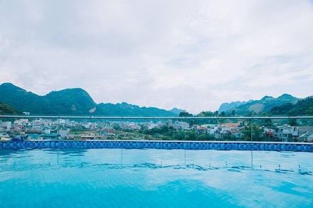 Indoor pool, pool umbrellas, sun loungers
