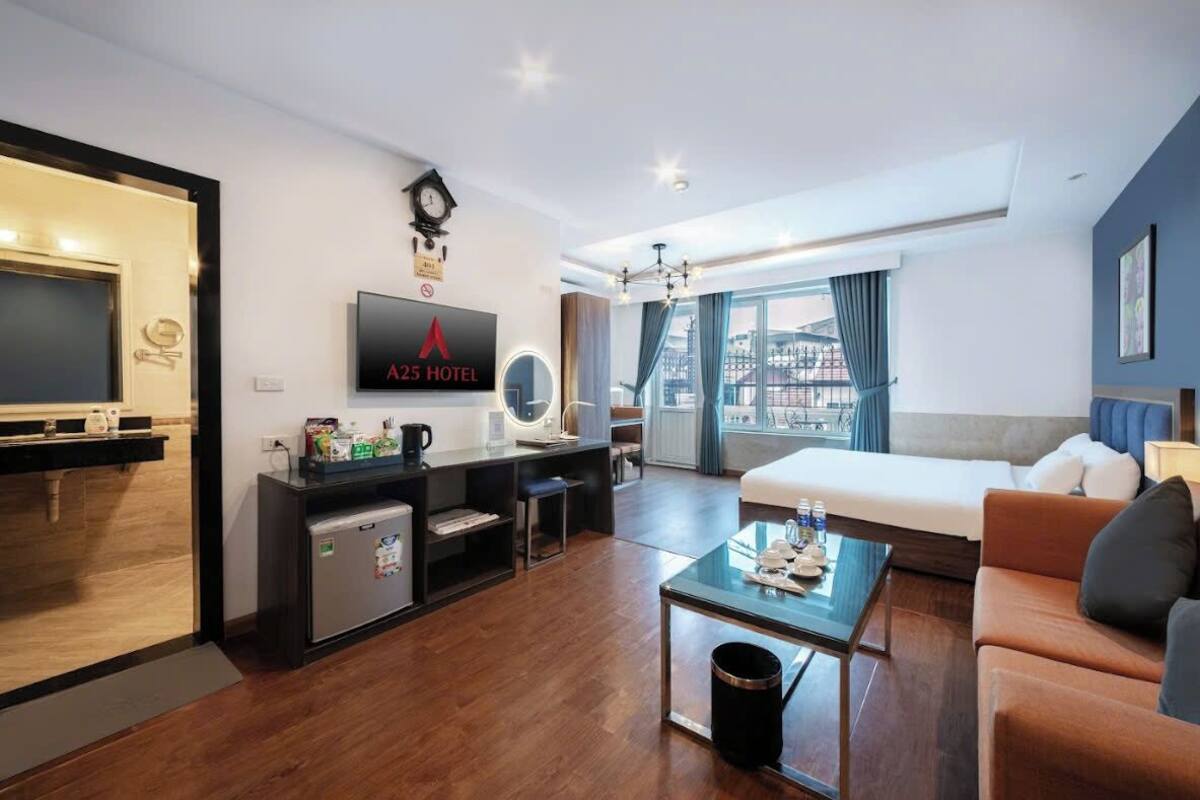 Family Suite | Minibar, in-room safe, blackout curtains, iron/ironing board