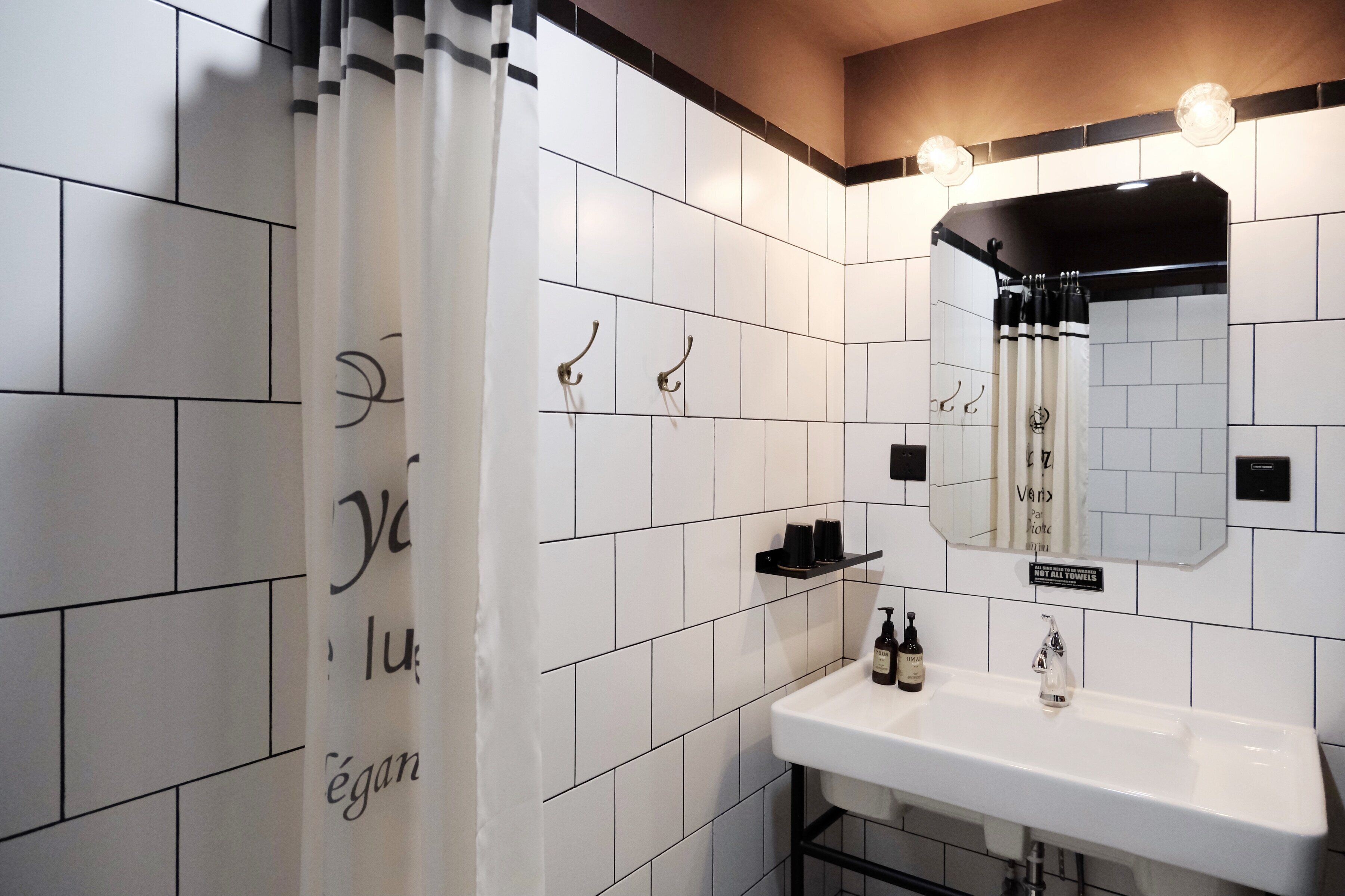 standard deluxe room | bathroom | shower, rainfall showerhead, designer toiletries, hair dryer