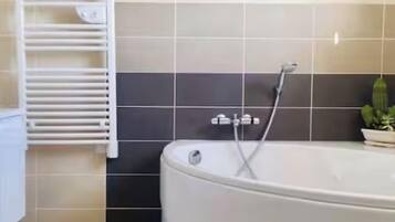 Bathtub, hair dryer, towels