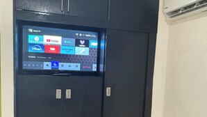A digital display on a door, listing various streaming services like YouTube, Spotify, and Netflix. - Casa Balam Cancun (Cancun)