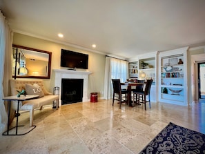 Smart TV, fireplace, DVD player, books