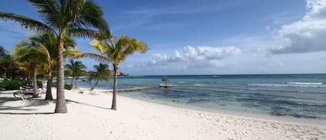 On the beach, sun loungers, beach towels