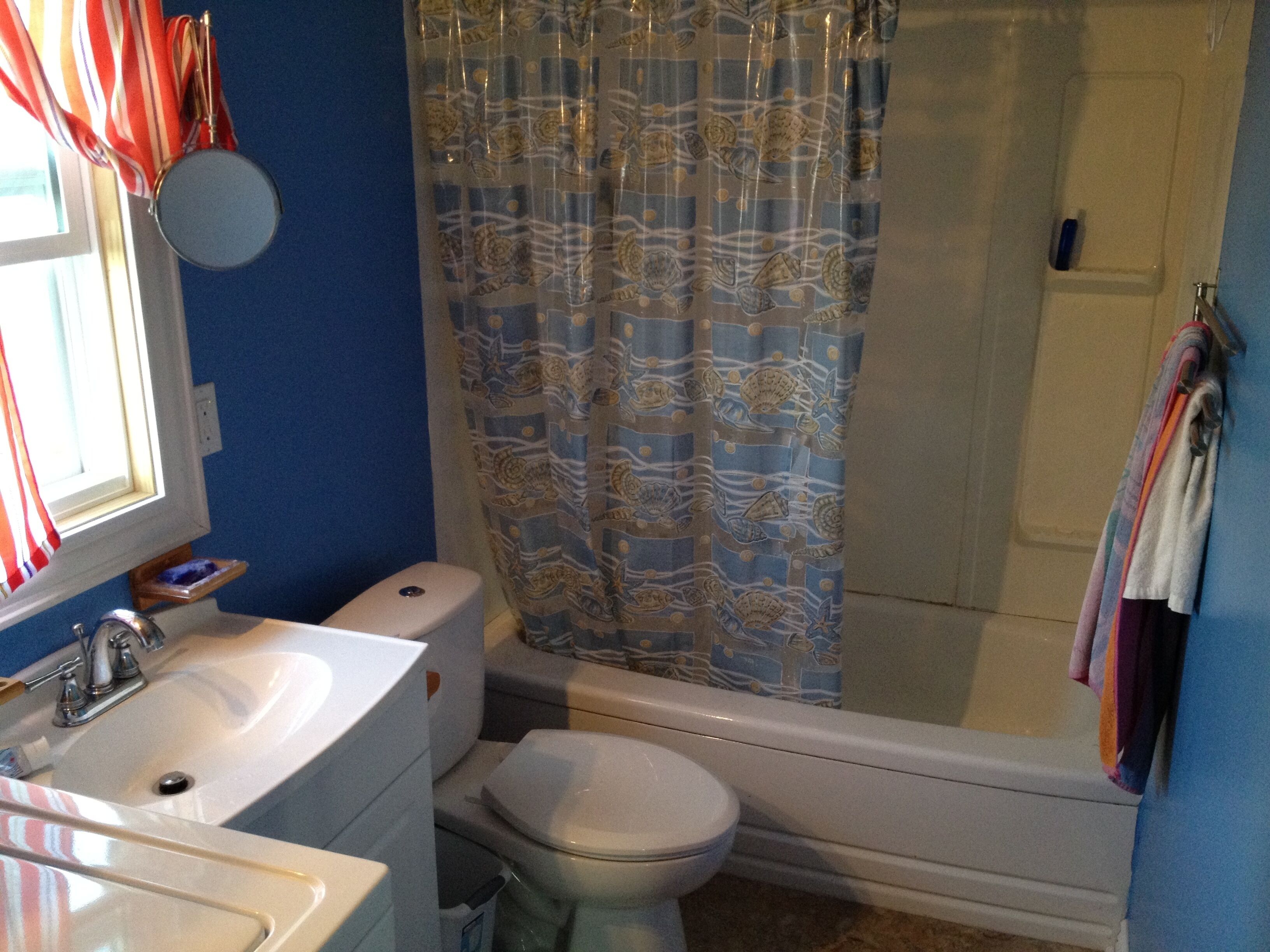 Combined shower/tub, hair dryer, towels, soap
