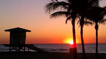 On the beach, sun loungers, beach towels