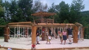 A wooden play structure with ropes and a small shelter. - Reduced 50%on30+daysBchMTN/2BR/2BthNew/Clean/Comfort/sleeps4/Wifi/Cable/2mi2rsrt (Beech Mountain)