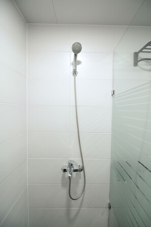 Triple Room (Foreigner Only) | Bathroom | Shower, free toiletries, hair dryer, slippers - Heima Guesthouse Hongdae (Seoul)