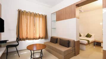 Deluxe Room | Minibar, individually furnished, desk, iron/ironing board