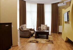 Standard Double Room | Living area | 38-inch LED TV with premium channels, TV