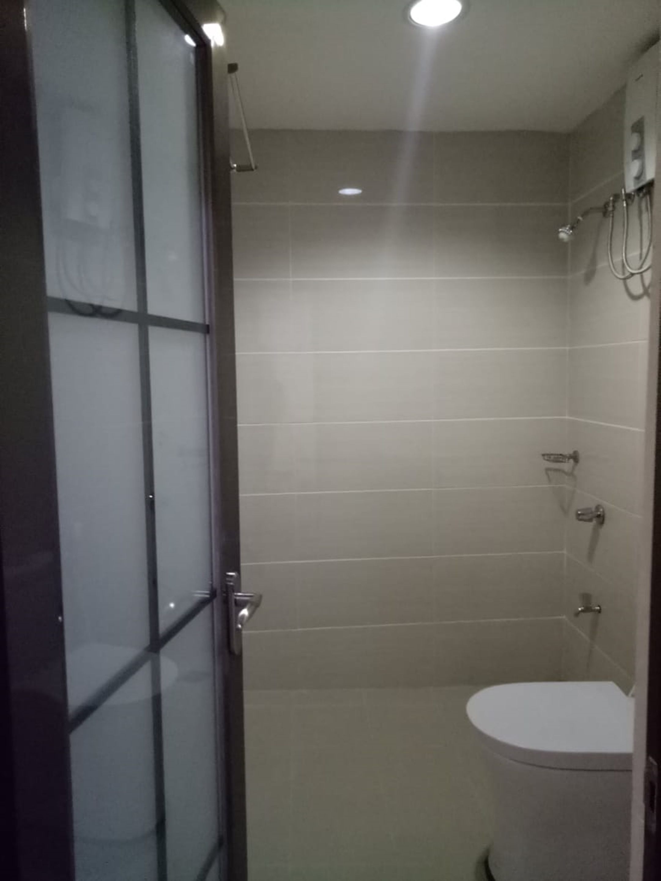 Shower, free toiletries, slippers, towels