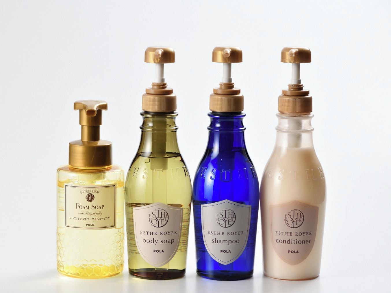 Four bottles of ESTHE ROYER body care products.