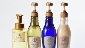 Four bottles of ESTHE ROYER body care products.