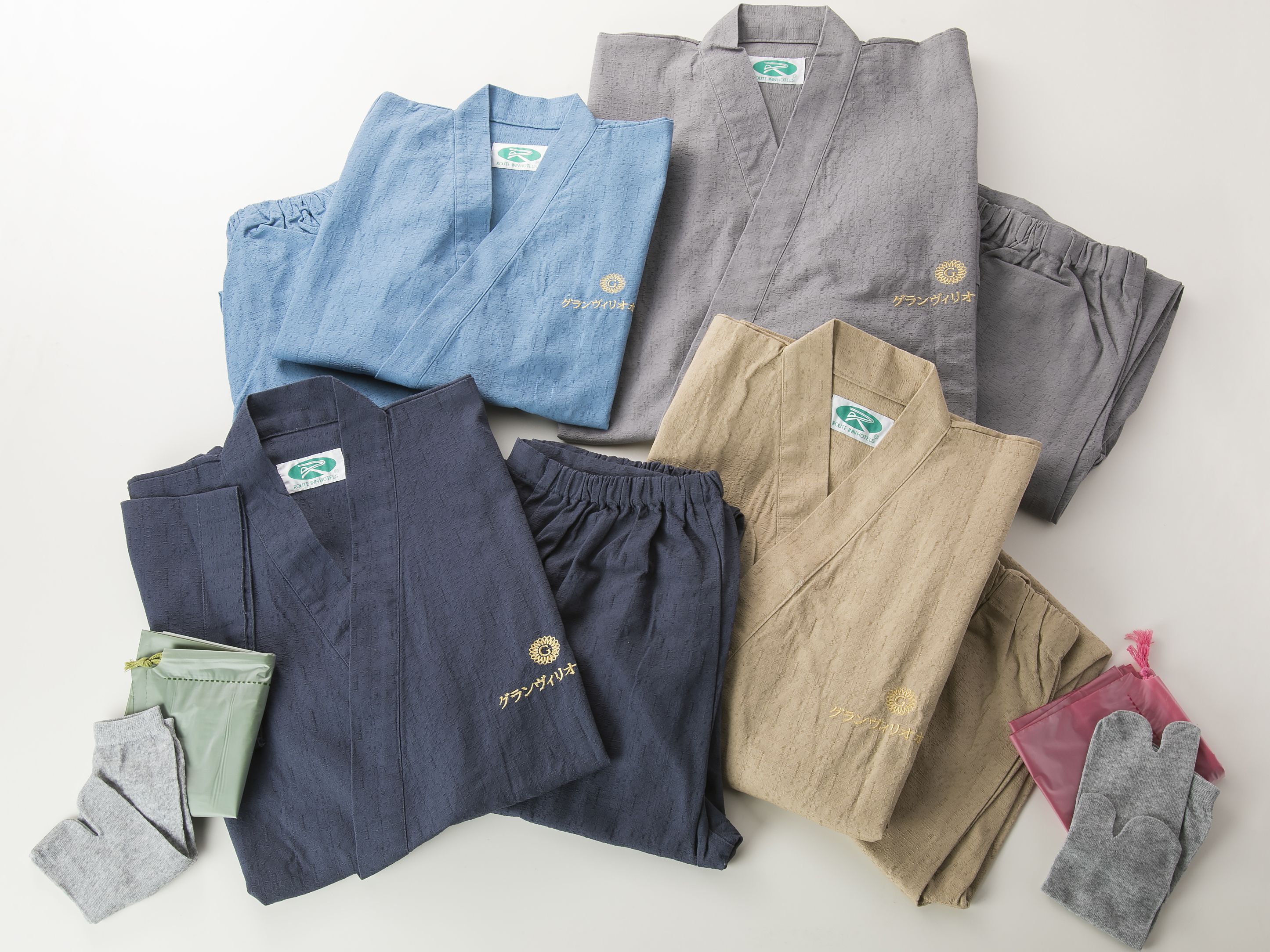 Various clothing items laid out on a flat surface.