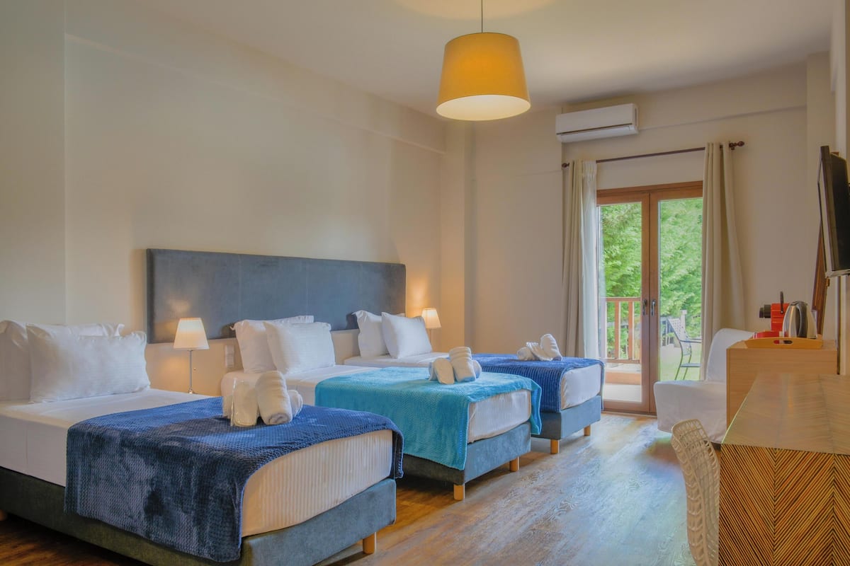Superior Triple Room, Pool View | Soundproofing, iron/ironing board (on request), WiFi (free), bed sheets