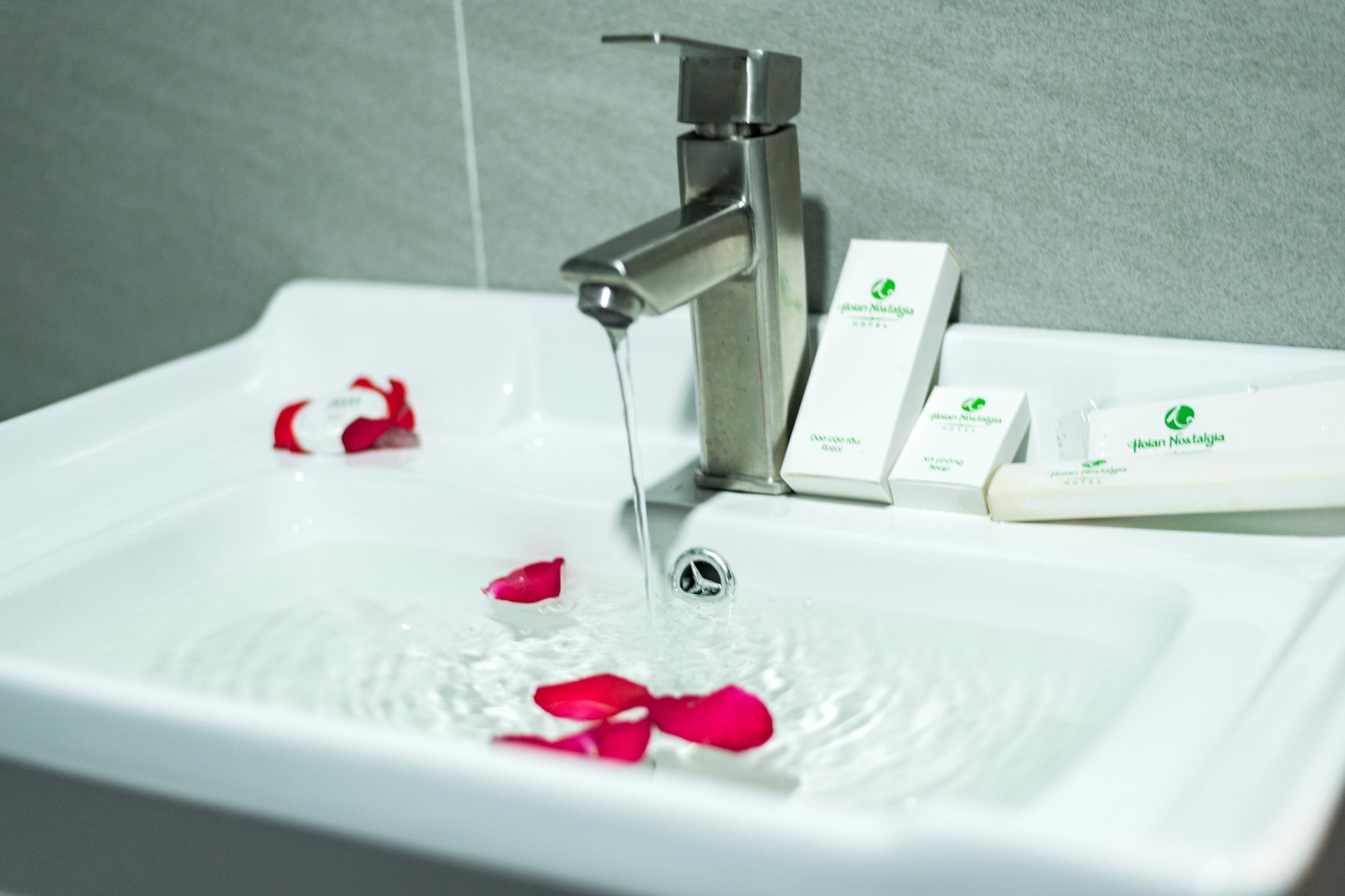 ancient triple with pool view  | bathroom sink