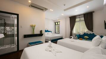 Deluxe Family Pool View | Minibar, in-room safe, desk, blackout drapes