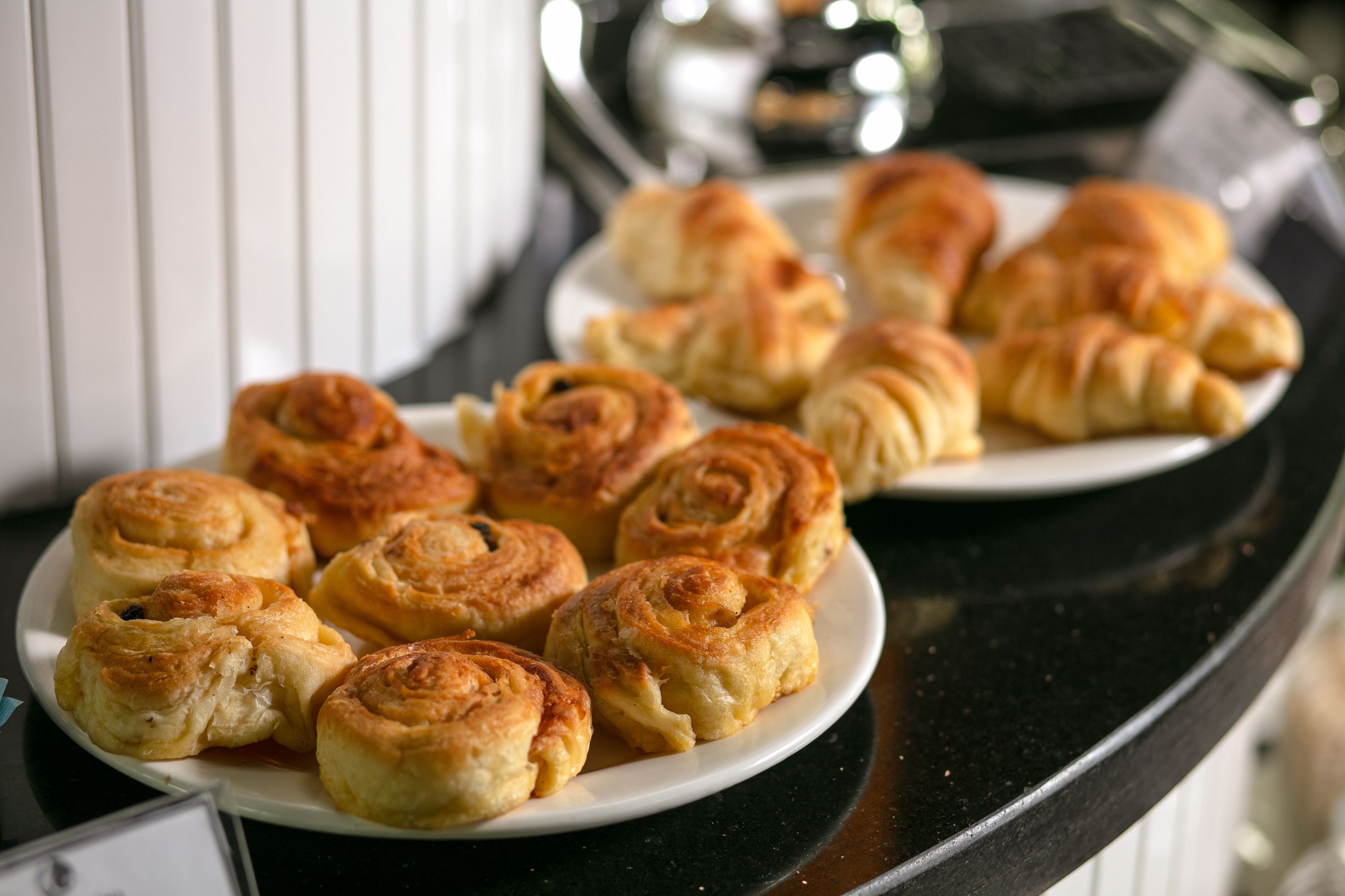 A plate of freshly baked pastries on a kitchen counter.