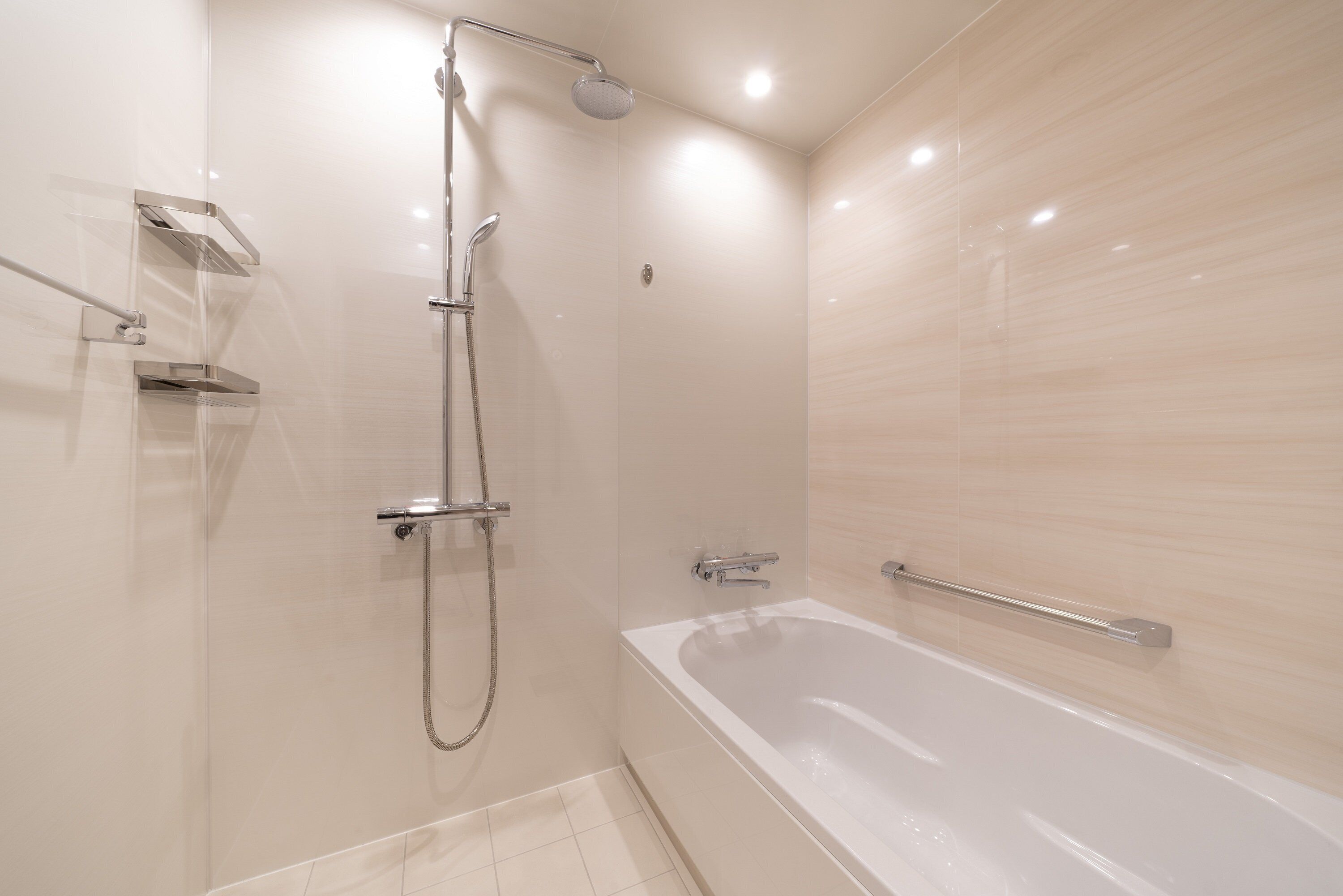separate bathtub and shower, rainfall showerhead, hair dryer, slippers