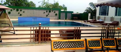 Outdoor pool, open 8 AM to 9 PM, pool umbrellas, sun loungers