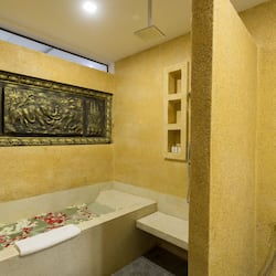Deluxe Triple Room, 1 Bedroom | Bathroom | Spring water bathtub, rainfall showerhead, free toiletries, hair dryer