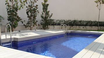 Seasonal outdoor pool, open 10 AM to 10 PM, pool loungers