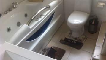 Exclusive Double Room, 1 Double Bed | Bathroom | Combined shower/bathtub, jetted bath, rainfall showerhead, towels