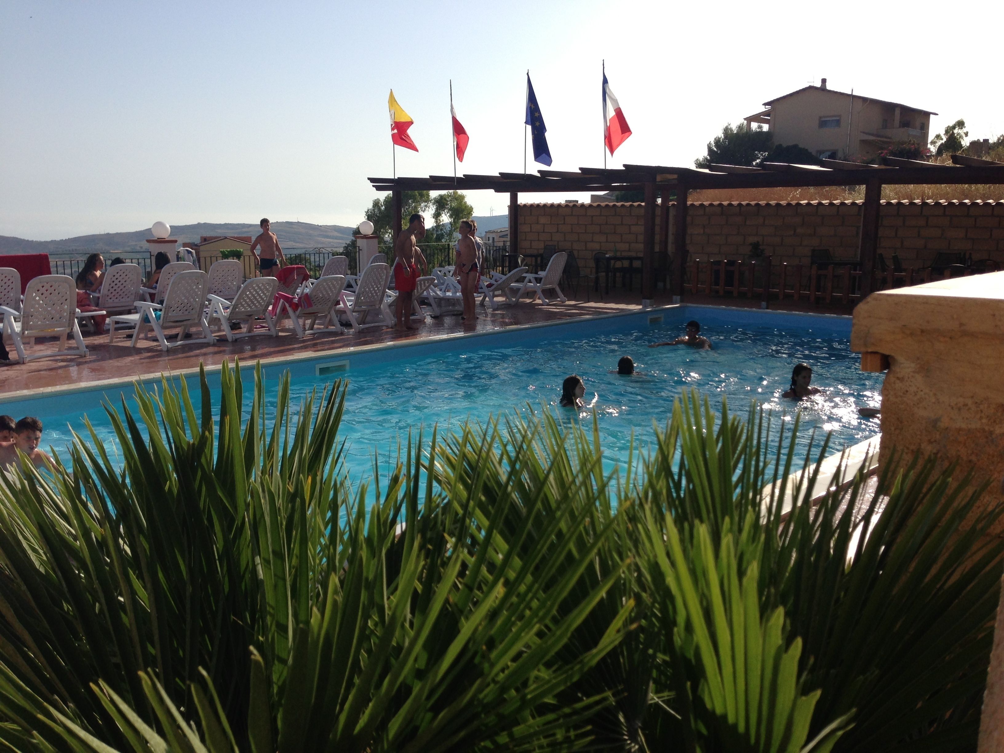 Seasonal outdoor pool, pool loungers
