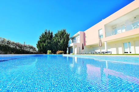 Outdoor pool, open 9:00 AM to 7:00 PM, sun loungers