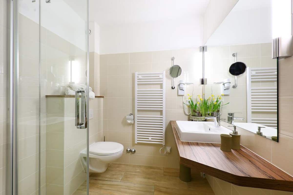 deep-soaking bathtub, rainfall showerhead, free toiletries, hair dryer