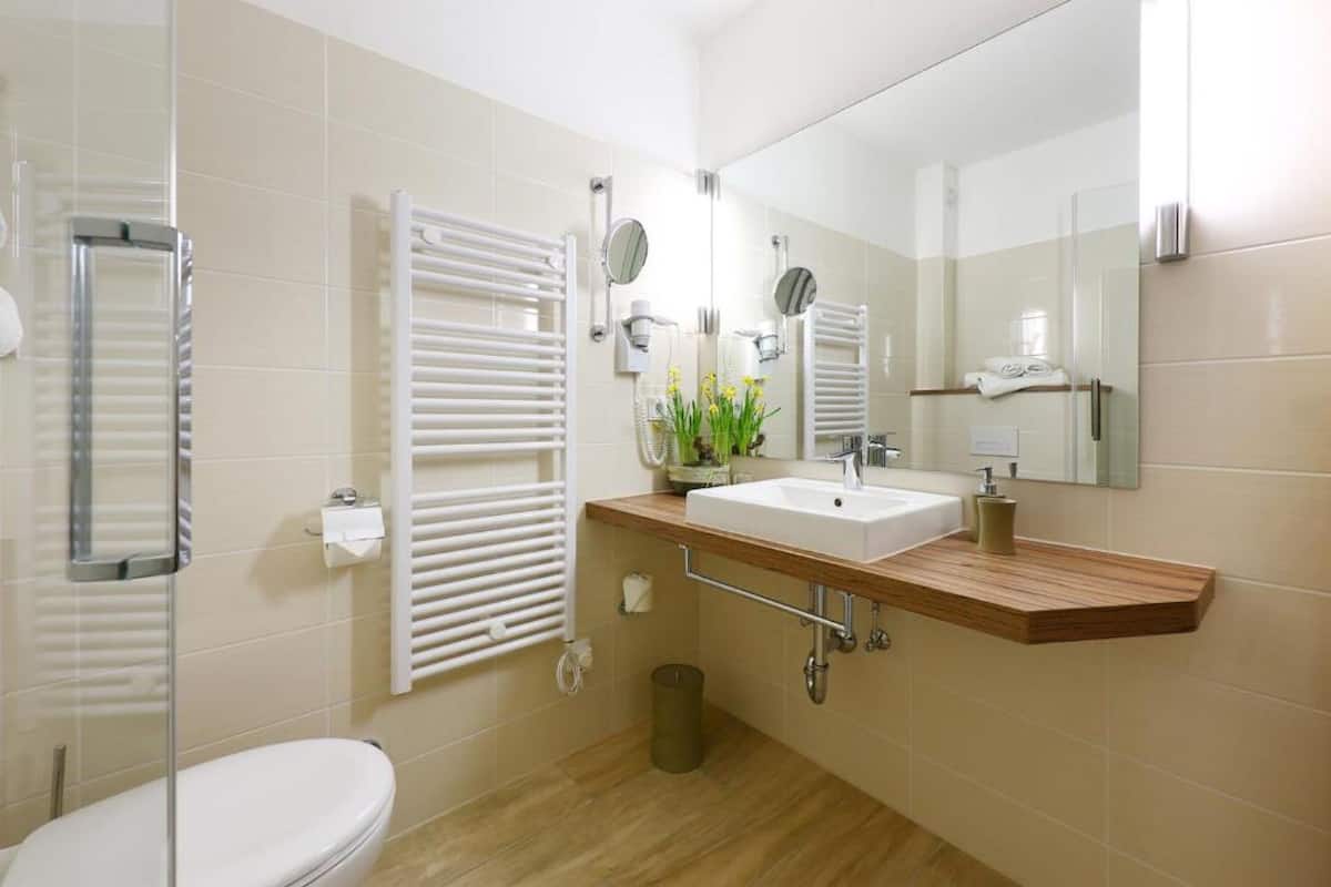 deep-soaking bathtub, rainfall showerhead, free toiletries, hair dryer