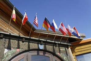 A building with multiple national flags displayed outside.