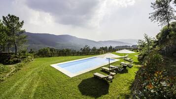 Seasonal outdoor pool, pool loungers