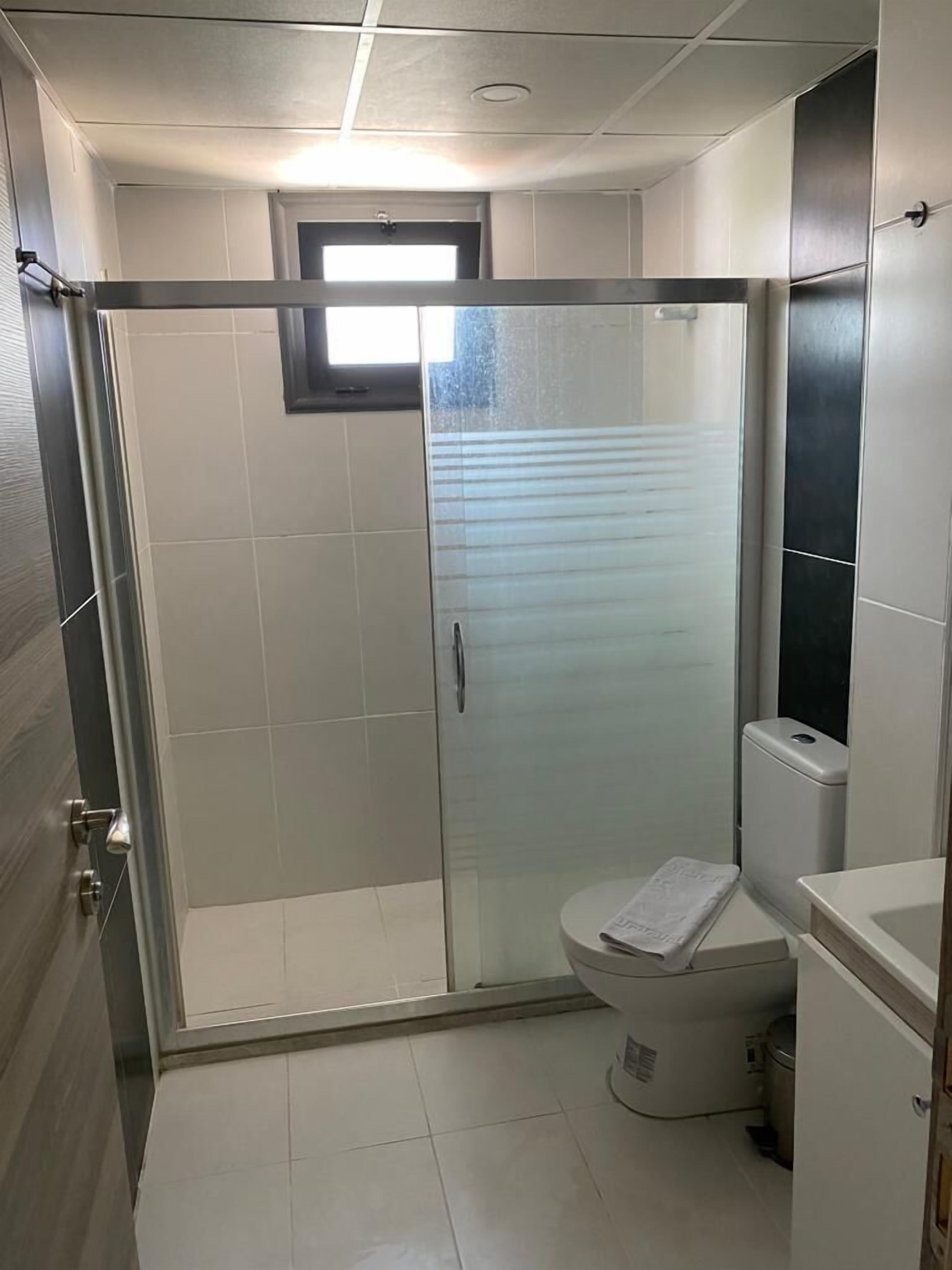 shower, hydromassage showerhead, hair dryer, slippers