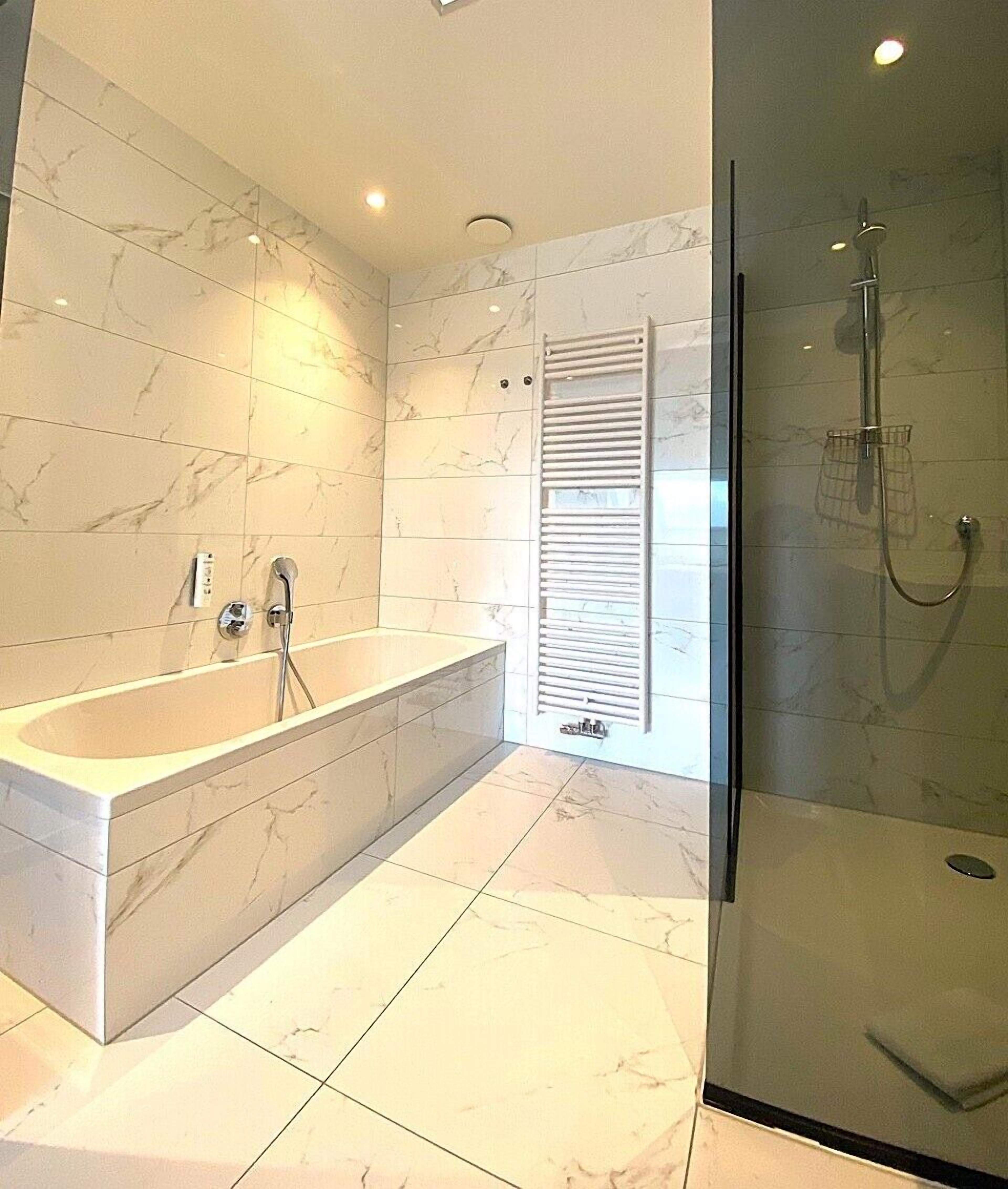 deluxe double room, 1 king bed | bathroom | free toiletries, hair dryer, towels, soap