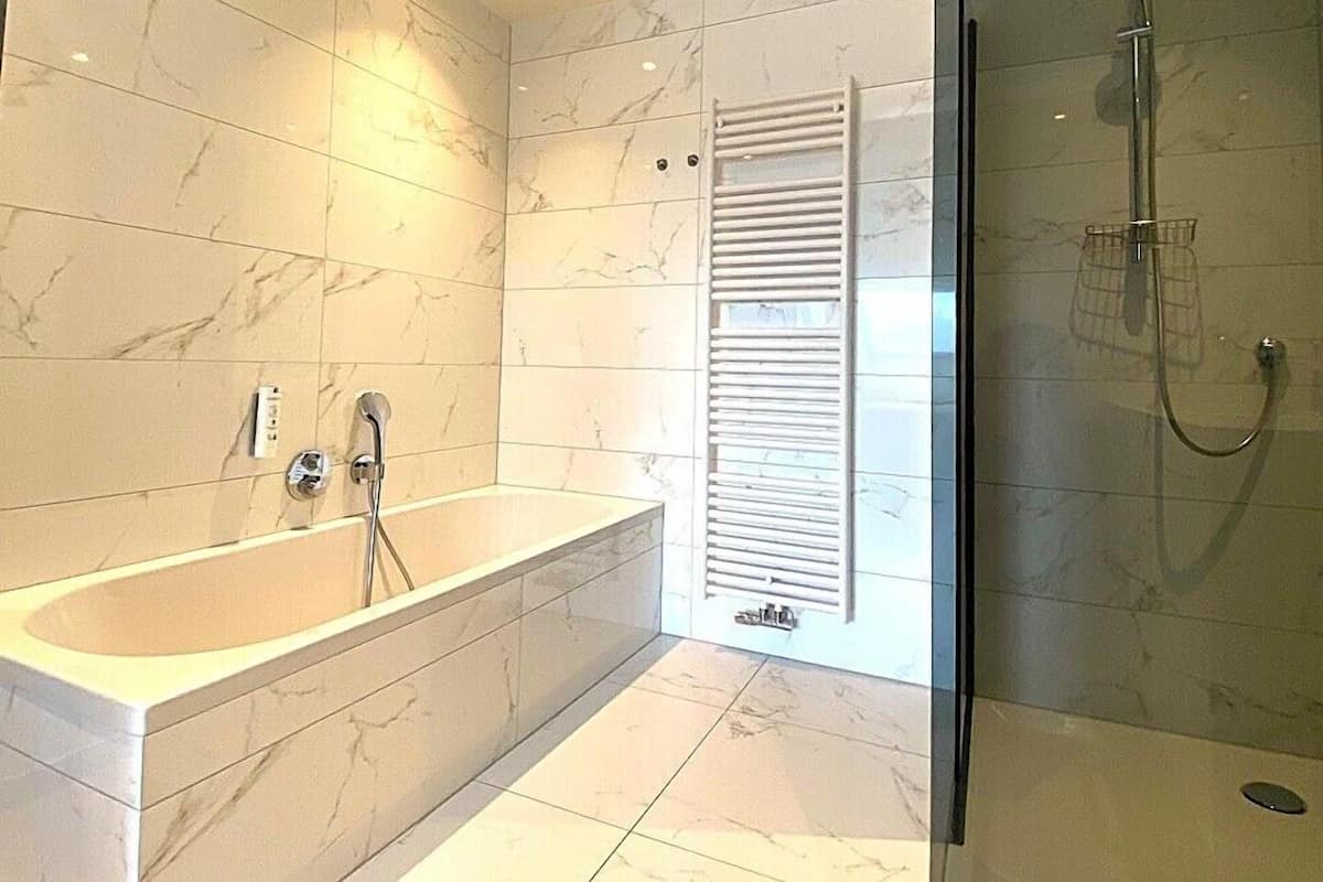 deluxe double room, 1 king bed | bathroom | free toiletries, hair dryer, towels, soap