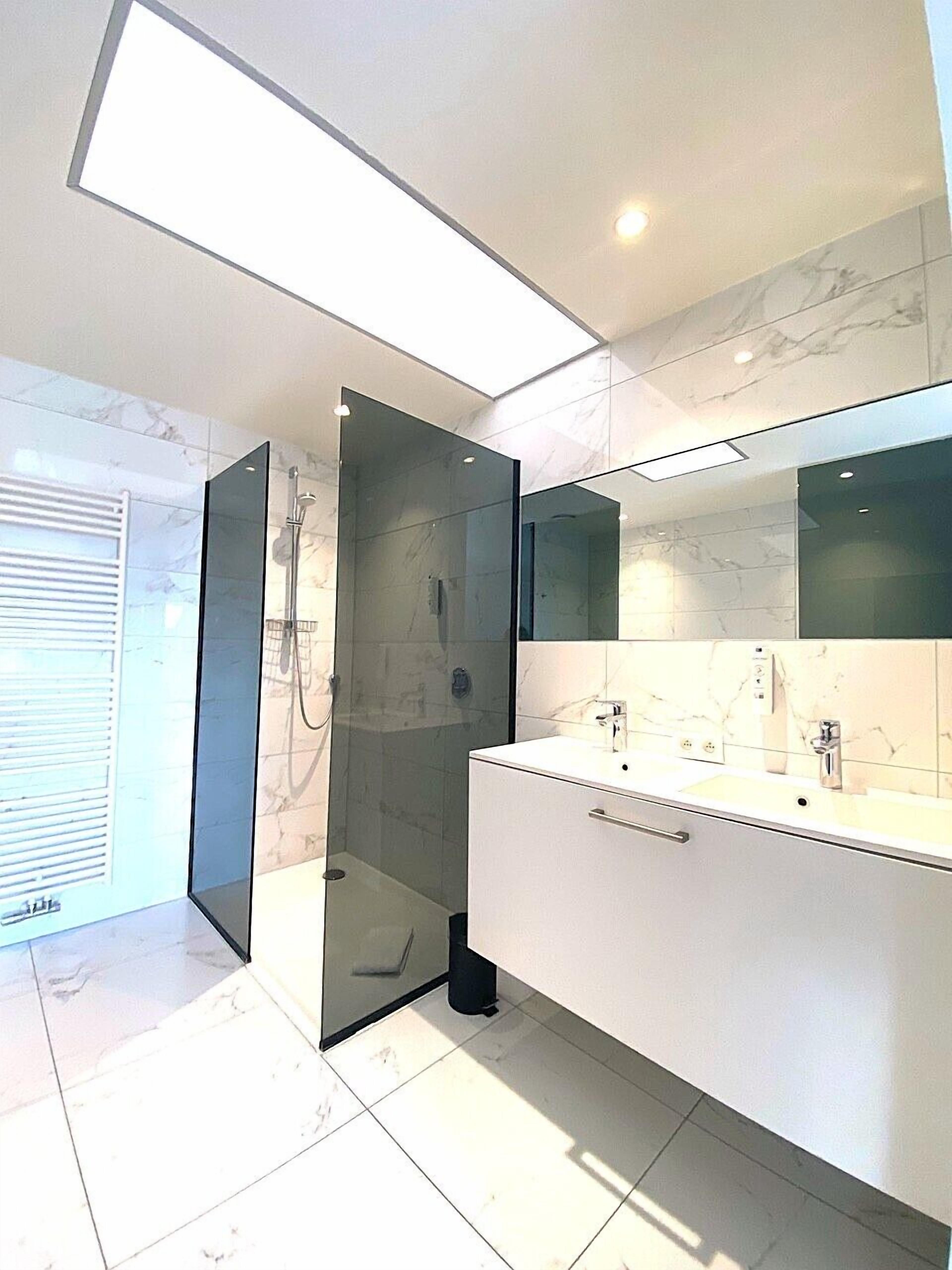 deluxe double room, 1 king bed | bathroom | free toiletries, hair dryer, towels, soap