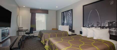 A hotel room with two beds, a desk, a TV, and a large window with a cityscape view.